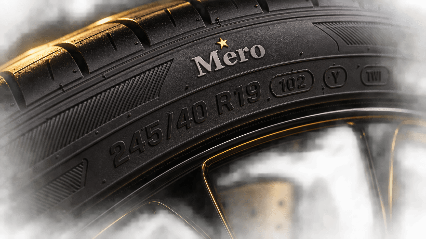 Close-up of tire size symbols on a Mero tire sidewall